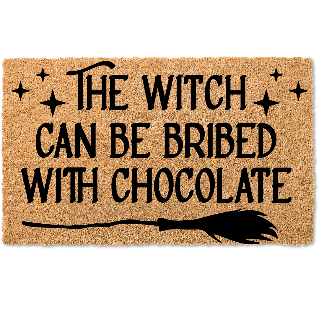 The witch can be bribed with chocolate halloween door mat