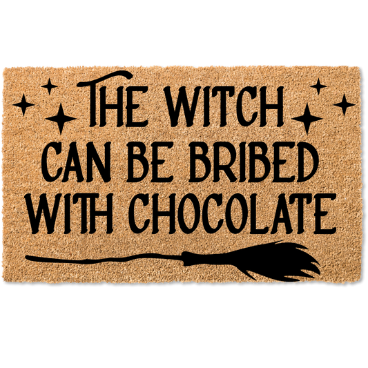 The witch can be bribed with chocolate halloween door mat